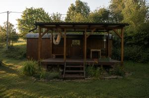 a gazebo in the middle of a yard at Maringotka MIMO in Uhelná