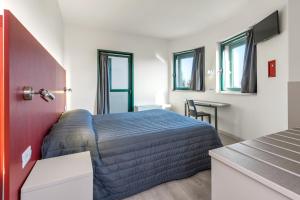 Posteľ alebo postele v izbe v ubytovaní Hotel Porta Palio