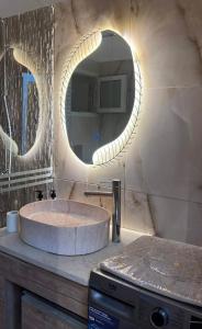 a bathroom with a large sink and a mirror at La perle de bizerte in Bizerte
