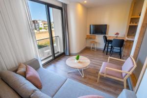 a living room with a couch and a table at Letstay Marine Homes in Antalya