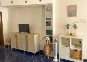 a room with a dresser with a tv on it at VERIGE VIEW Kamenari in Donja Jošica