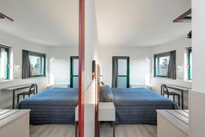 Posteľ alebo postele v izbe v ubytovaní Hotel Porta Palio