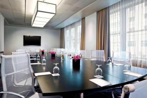 a conference room with a long table and chairs at W Minneapolis - The Foshay in Minneapolis