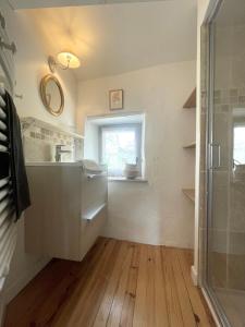 a bathroom with a shower and a sink and a window at Chez Marie in Grignan +19 photos