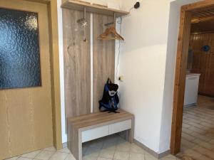 a black cat sitting on a bench in a room at Haus Lüftleck in Lunz am See