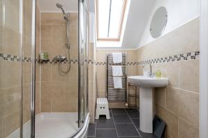 a bathroom with a shower and a sink at Craiglea - Elie & Earlsferry in Earlsferry +24 photos