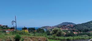 a view of a town from a hill at Le rêve bleu in Collioure +21 photos