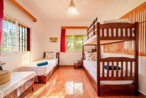 two beds in a room with a bunk bed at Paradise Farm 20 min from Rabat By MasterHost with AC in Salé