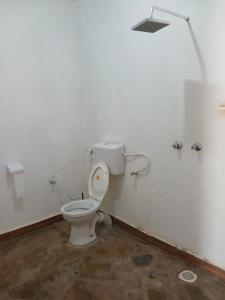 a bathroom with a toilet in a room at Gabsgate Resort Kilifi in Kilifi