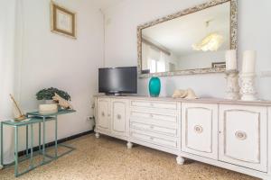 a dresser with a mirror and a tv on it at Construcciones Balaguer in Mancor del Valle
