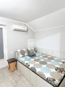 a bedroom with a large bed in a room at Hotel Dulgher in Giurgiuleşti +7 photos