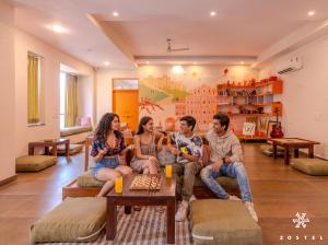 a group of people sitting on a couch in a living room at Zostel Jaipur in Jaipur +27 photos