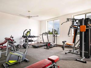 a gym with several treadmills and exercise bikes at Nungwi Dreams by Mantis in Nungwi