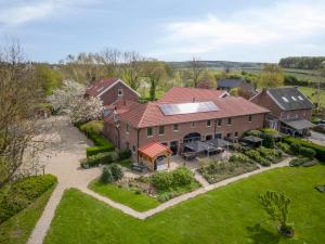 an aerial view of a large house with a yard at Appartement met panorama-uitzicht op het Geuldal, terras, Vijlen in Vijlen