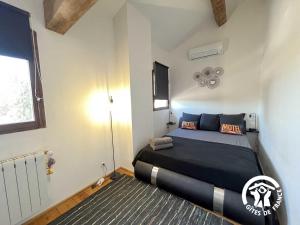a bedroom with a large bed in a room at L'hacienda in Pia +35 photos