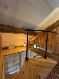 a wooden staircase in a room with wooden floors at Grand péric in Puyvalador +21 photos