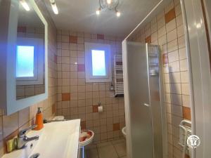 a bathroom with a shower and a sink and a mirror at Le moulin in Sahorre +27 photos