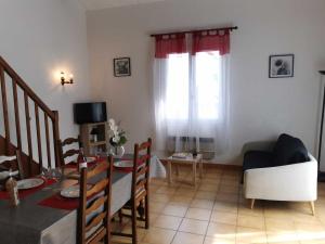 a living room with a table and a dining room at Desix in Trilla