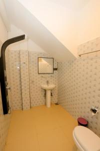 a bathroom with a toilet and a sink at Ivory Canopy Resort - Ella in Ella +38 photos
