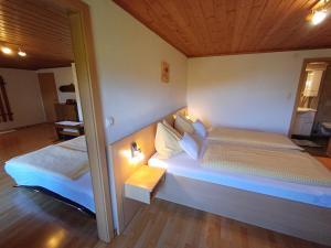 a bedroom with two beds in a room at Ferienhaus Regina in Werfenweng +36 photos