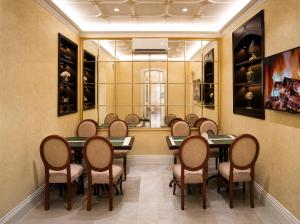 a meeting room with a table and chairs at Midway Park Hotel in Baku