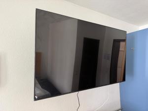 a mirror hanging on a wall in a room at Hotel zur Post - Schrobenhausen in Schrobenhausen