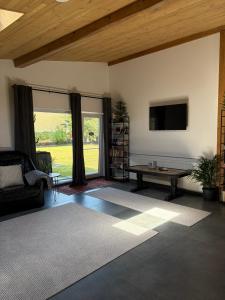 a living room with a television and a table at Vacation with Purpose in Gura Humorului