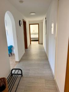 a hallway of a house with a bench on the floor at Weserglück Ferienwohnung Grohnde in Emmerthal