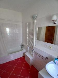a bathroom with a white tub and a sink at Penzion Čistá in Černý Dŭl +42 photos