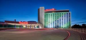 a hotel building with a road in front of it at Harrah's Council Bluffs Hotel & Casino - A Caesars Rewards Destination in Council Bluffs
