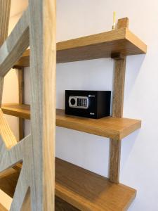 a book shelf with a radio on it at Hotel Azure Cartagena in Cartagena de Indias