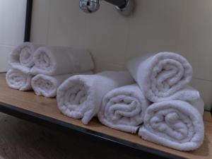 a pile of towels on a shelf in a bathroom at El 9 Baral-la in Sant Pau de Segúries +64 photos