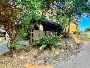 a small house on the side of a road at Athule Inn - Mozambique in Chidenguele