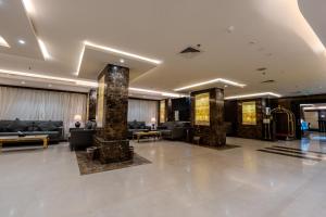 a lobby of a hotel with couches and tables at فندق الراحة السويسرية Swiss Repose Hotel in Jeddah