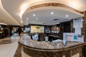 a lobby with a marble counter in a building at فندق الراحة السويسرية Swiss Repose Hotel in Jeddah