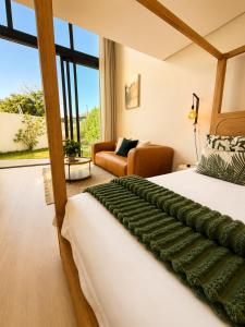 a bedroom with a bed and a living room at 4 Lulworth in Johannesburg +75 photos