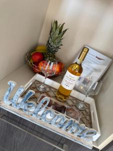 a bottle of wine and a sign in a refrigerator at Villa Ammos Seaside in Koumeika