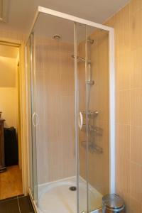 a shower with a glass enclosure in a bathroom at La forge 2/5 personnes in Saint-Pierre-de-Nogaret +28 photos