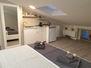 a kitchen with towels on the floor in a room at Dimore Angye in Termoli