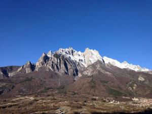 a mountain with snow on top of it at Casa Grevo Bed and Breakfast in Cedegolo
