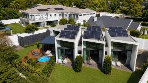 an aerial view of a house with solar panels on the roof at 4 Lulworth in Johannesburg