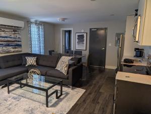a living room with a couch and a table at Clifton Hill suite 2201 in Niagara Falls