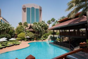 a view of a swimming pool at a resort at Gulf Executive Residence in Manama