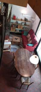 a living room with a table and a couch at Dix doré in Blaimont +4 photos