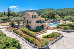 an image of a villa with a swimming pool at Villa Emelisse by Villa Plus in Fiskardo