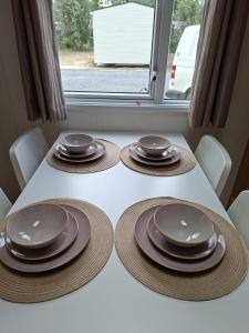 a table with four plates and hats on it at De Zandparel in Poortvliet +8 photos