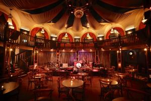 a room filled with tables and chairs in a building at The Bedford Balham - Live Music Venue in London