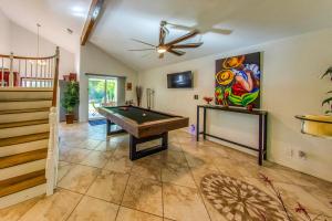 a room with a pool table and a painting on the wall at Pool & Yard Games! Group Retreat in La Quinta in La Quinta