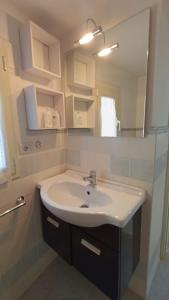 a bathroom with a sink and a mirror at Il Nido nel Borgo in Piediluco +8 photos
