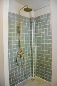 a shower with blue tiles and a shower head at Sunny Mountain in Ban Nong Hoi +32 photos